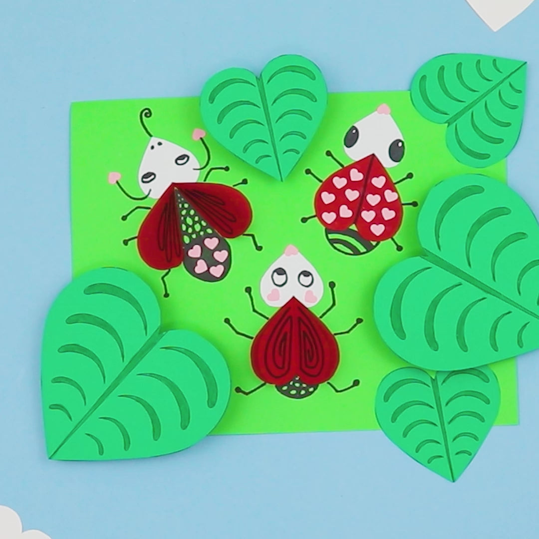 Lovebug craft for kids combining paper hearts and drawing. The finished craft has a cool 3D effect.